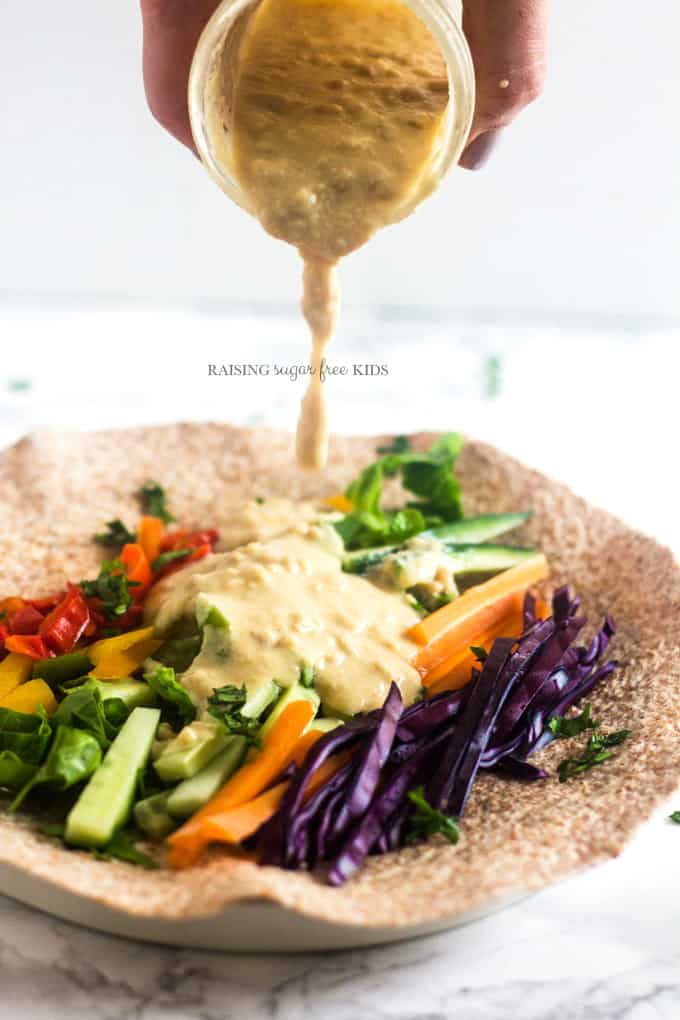 Rainbow Wraps with Peanut Sauce | Raising Sugar Free Kids - this delicious lunch is packed full of vegetables in all colours, and covered in a simple, yummy sugar free peanut sauce. Making "eating the rainbow" fun and easy. #sugarfree #vegpower #eattherainbow