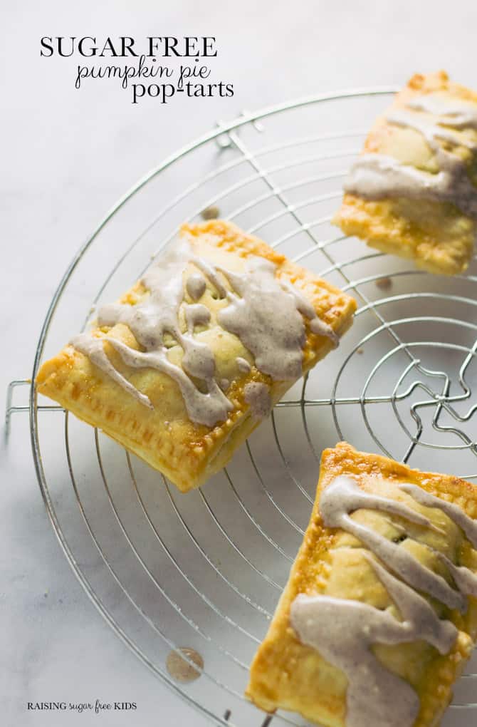 Sugar Free Pumpkin Pie Pop-Tarts | Raising Sugar Free Kids - delicious flaky pastry filled with warming, sweet pumpkin pie filling and finished with a yogurt pumpkin spice glaze. These pop-tarts are delicious, and they just happen to also be sugar free! #sugarfree #pumpkin #fall 