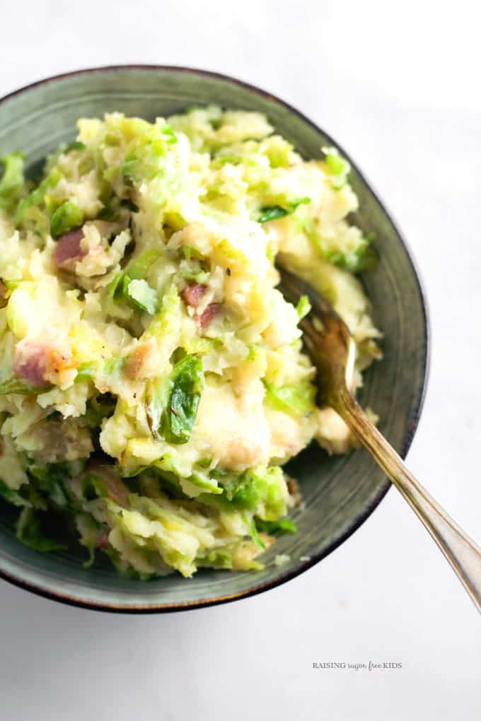 Bacon & Sprout Colcannon (Gluten & Dairy Free) | Raising Sugar Free Kids - delicious comfort food at its best. This colcannon is creamy and filling, but nutritious, heavy on the veg, and with dairy free options. It is a great way to get some of the amazing goodness of sprouts into the family. A cheap, simple winter family dinner. #glutenfree #dairyfree #sugarfree 