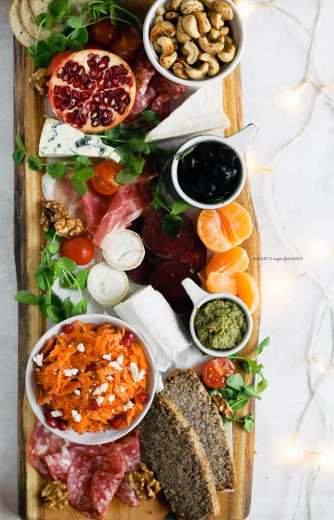 How to Make a Christmas Antipasti Board | Raising Sugar Free Kids - a healthier take on a platter containing just meats, cheese, sugary chutneys and dried fruit, this antipasti board features fresh fruit and veg, and is delicious and easy to boot! A great addition to the Christmas dinner - let's fill everyone up with veg first! ;) #christmas #vegetables #sugarfree #glutenfree #antipasti