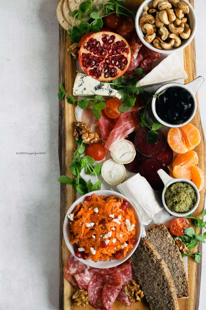 How to Make a Christmas Antipasti Board | Raising Sugar Free Kids - a healthier take on a platter containing just meats, cheese, sugary chutneys and dried fruit, this antipasti board features fresh fruit and veg, and is delicious and easy to boot! A great addition to the Christmas dinner - let's fill everyone up with veg first! ;) #christmas #vegetables #sugarfree #glutenfree #antipasti