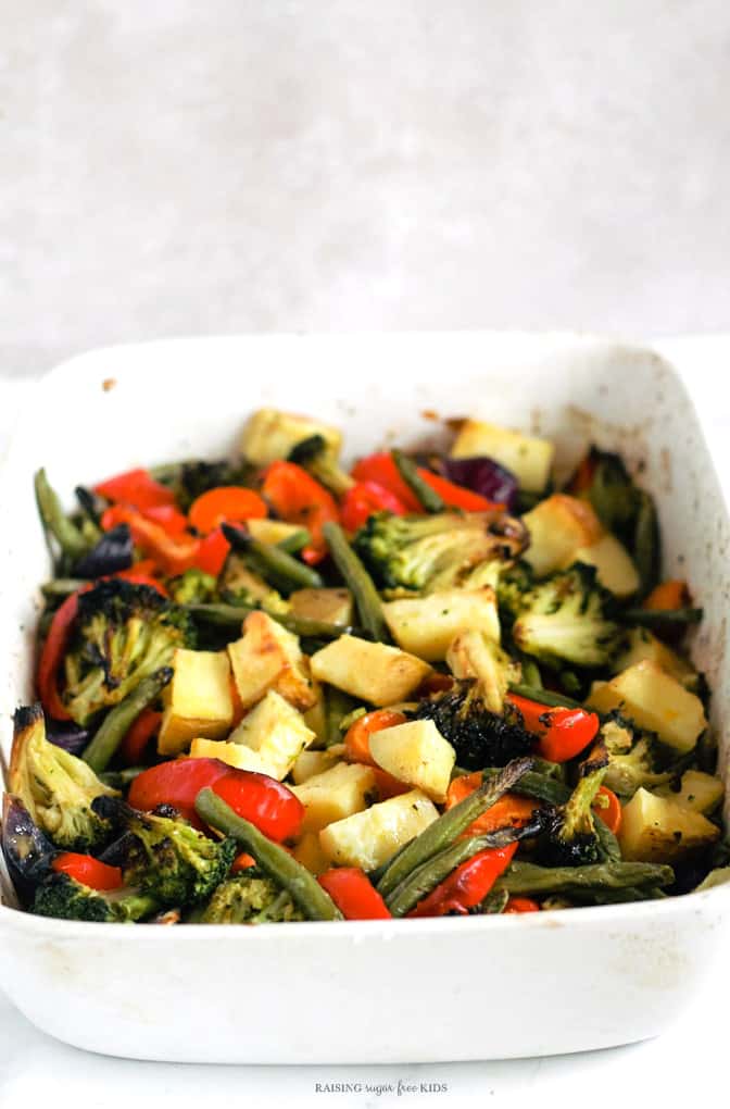 One-Tray Pesto Roasted Rainbow Veg | Raising Sugar Free Kids - a really easy tray of rainbow vegetables roasted to perfection and drizzled with 30-second parsley pesto. Perfect to batch-roast on the weekend for lunchboxes, sides and snacks in the week. #sugarfree #poysugarfreejanuary #glutenfree #dairyfree #vegan 