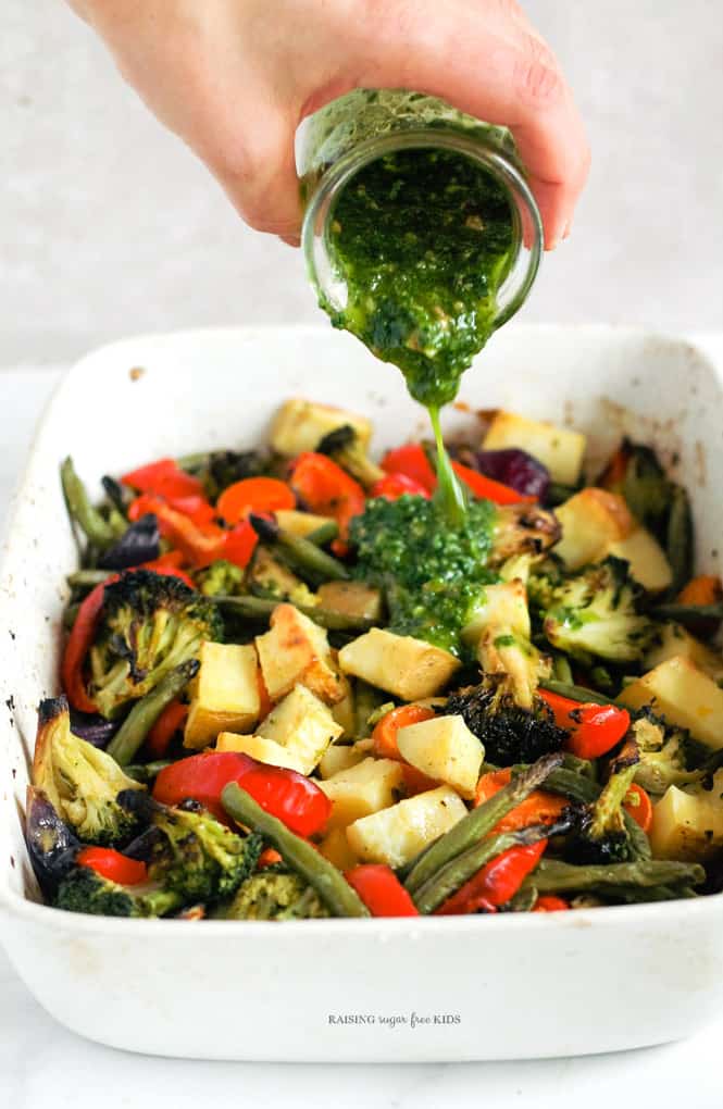 One-Tray Pesto Roasted Rainbow Veg | Raising Sugar Free Kids - a really easy tray of rainbow vegetables roasted to perfection and drizzled with 30-second parsley pesto. Perfect to batch-roast on the weekend for lunchboxes, sides and snacks in the week. #sugarfree #poysugarfreejanuary #glutenfree #dairyfree #vegan 
